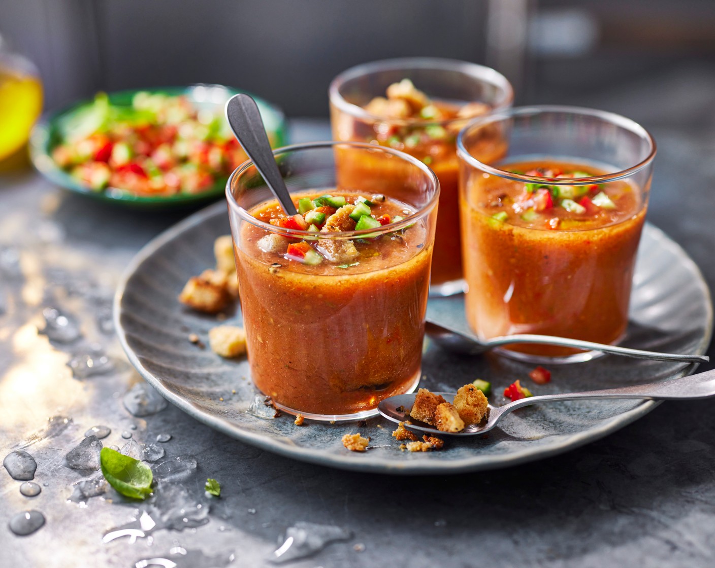 step 4 Pour the gazpacho into bowls and garnish with the reserved pepper, cucumber, basil (1/2 handful), M&S sea salt and black pepper croutons (1 pack) and a drizzle of olive oil.