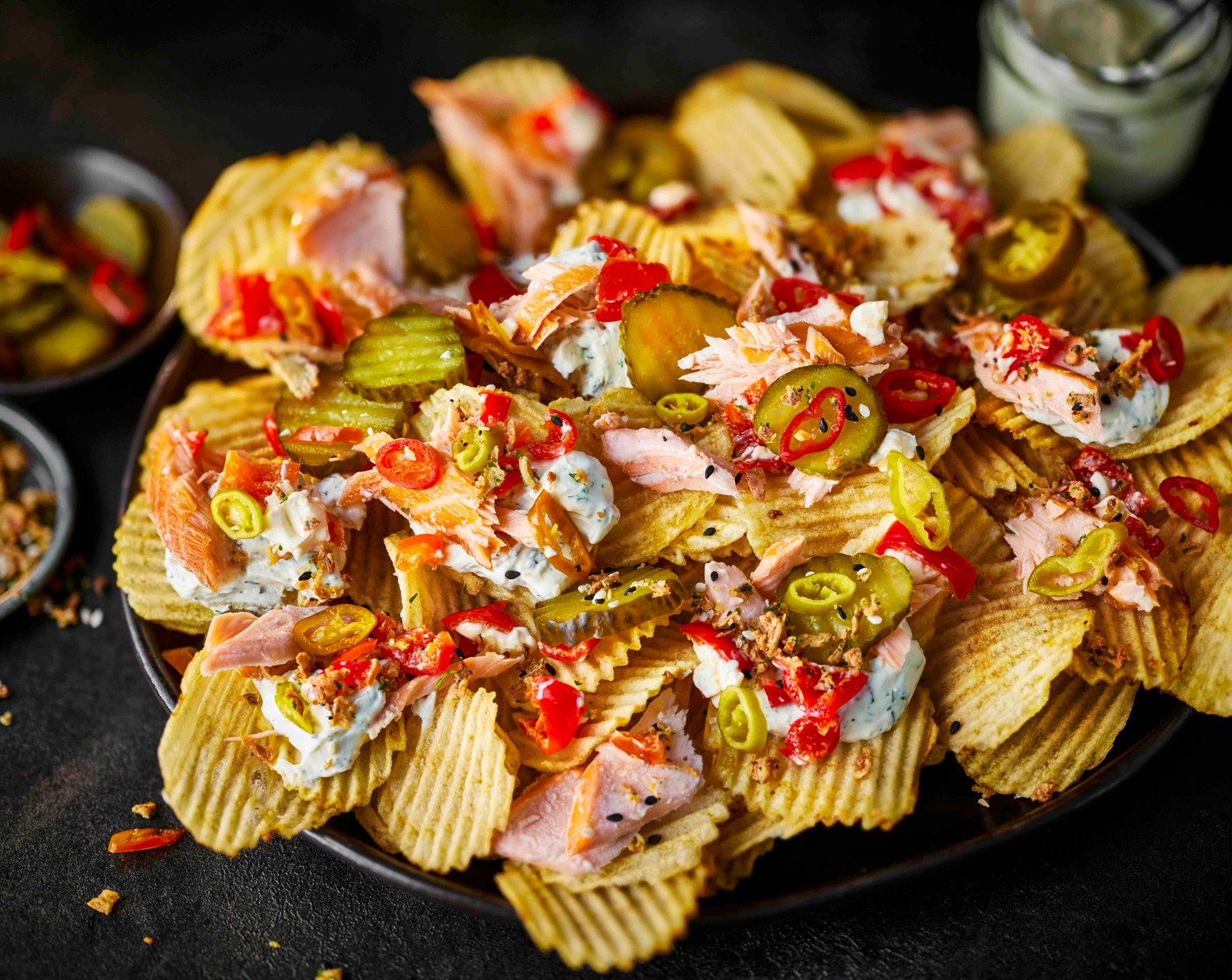 step 2 Finish with the fiery pickles (2 tbsp), pickled chillies (2) and top that seasoning (1 tbsp).