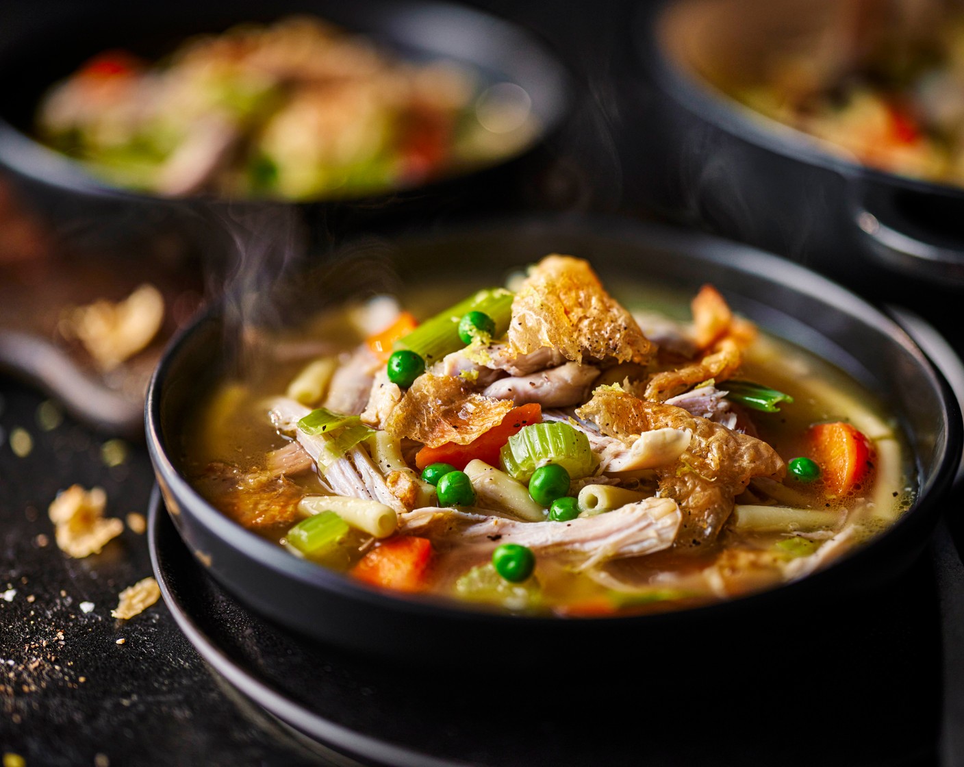 step 8 Serve the soup in bowls topped with the crispy chicken skin, lemon zest and a grating of black pepper.