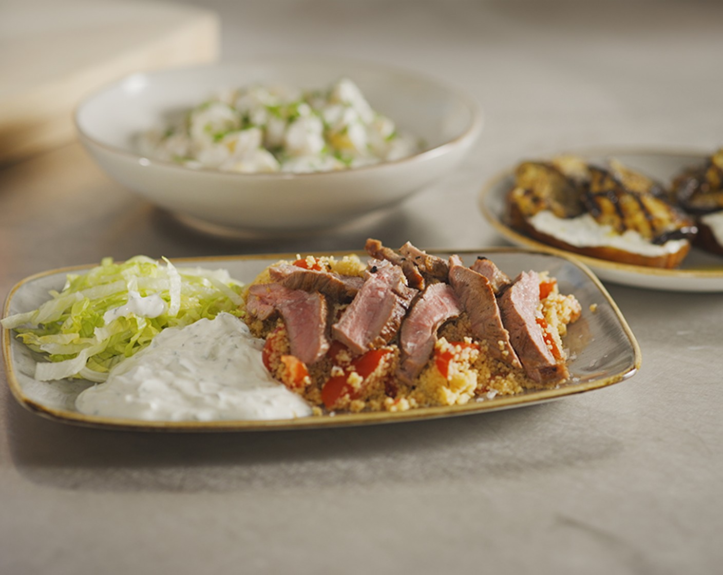 step 7 Top with shredded lettuce (1) and a large spoonful of tzatziki (1 pot).