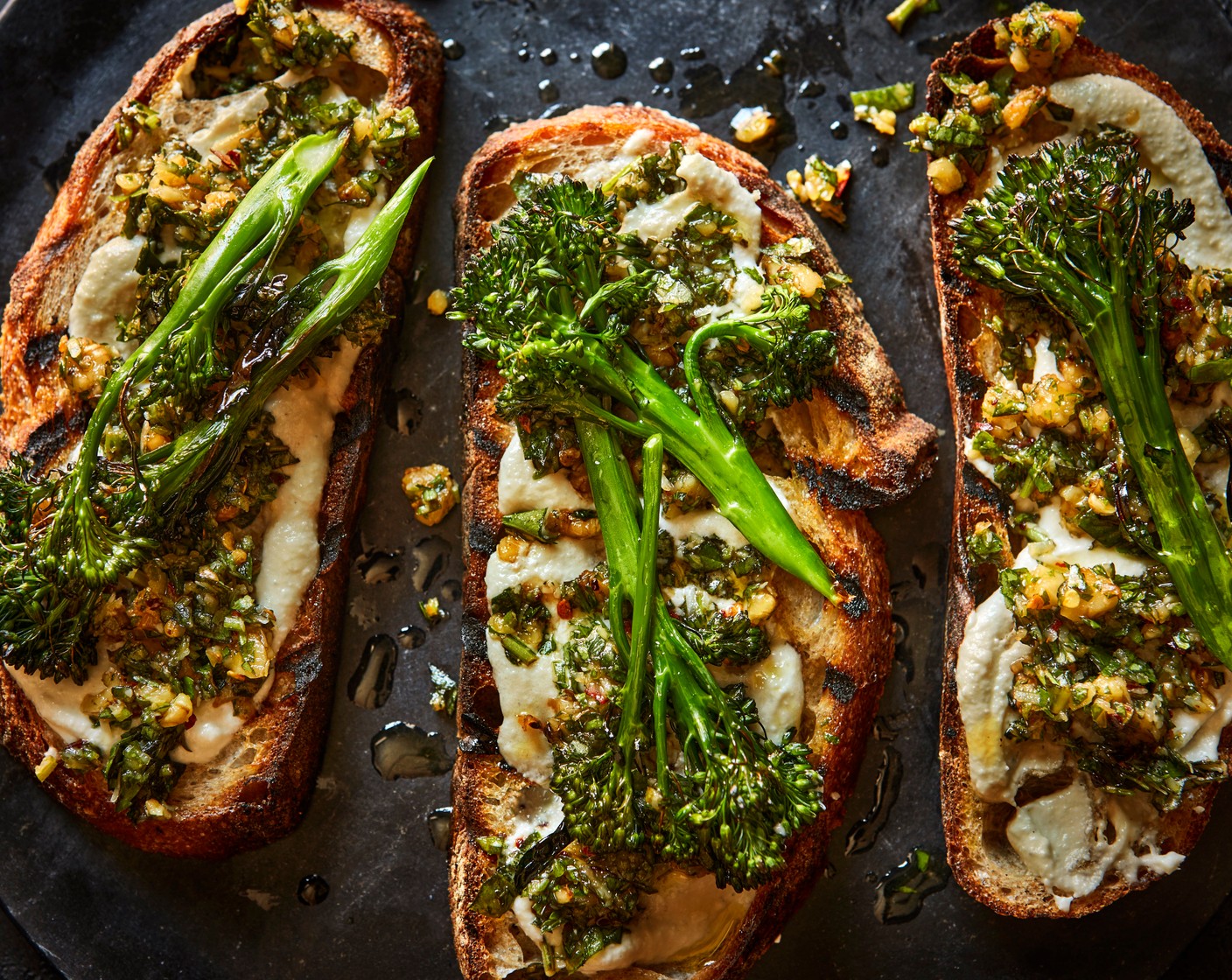 step 4 Toast the sourdough (4 slices) and spread a generous layer of the whipped goat's cheese on top of each slice. Toss the broccoli in the pesto and lay on top of the goat’s cheese.