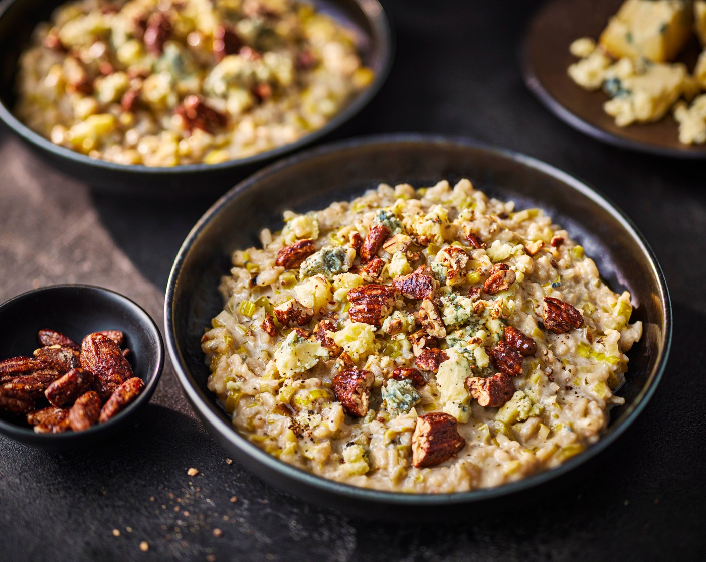 step 3 Serve the risotto in bowls, topped with the remaining Stilton (100 g), a scattering of caramelised pecans (75 g) and a drizzle of lemon-infused olive oil (1 tbsp).