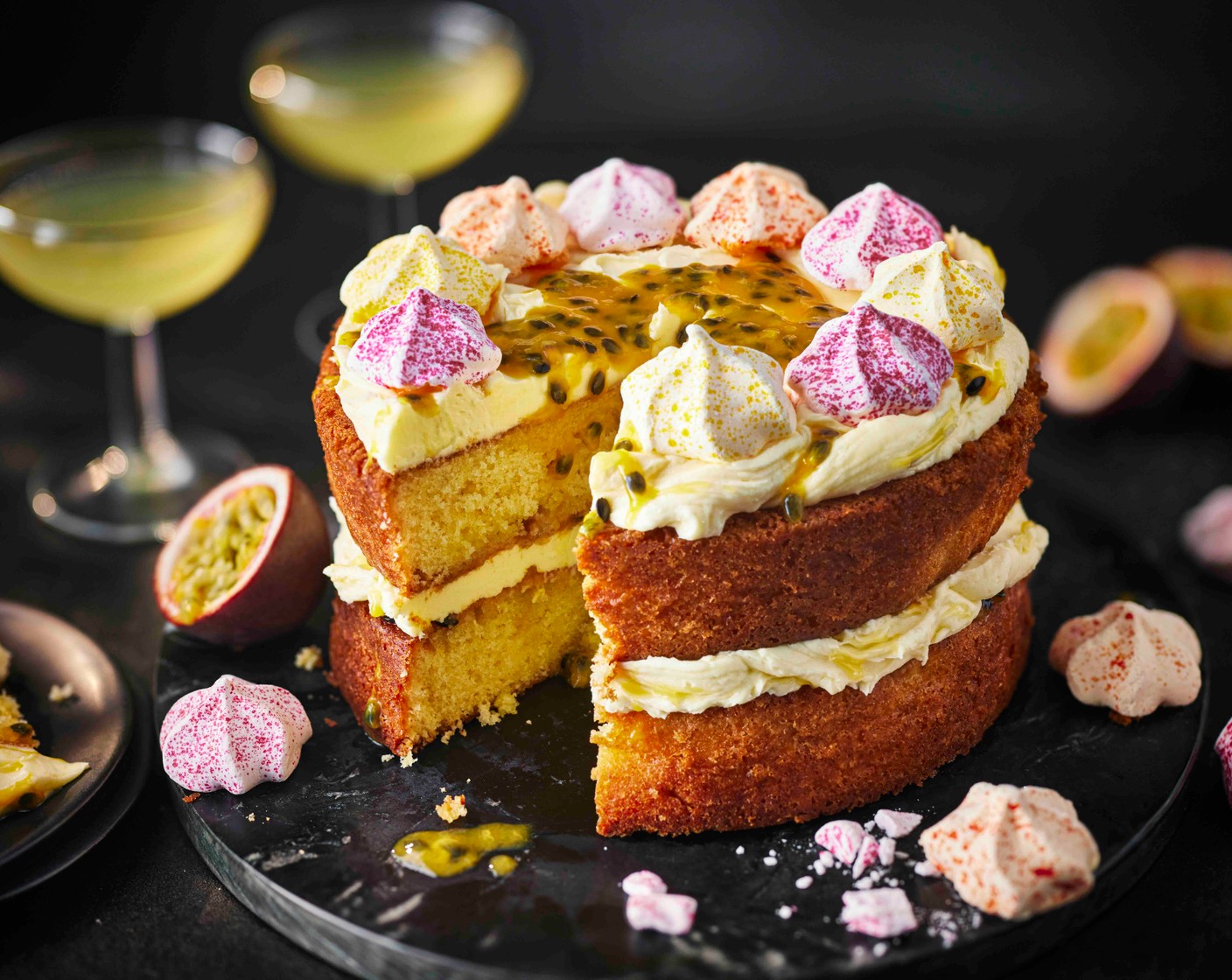 step 7 Spread a thick layer of buttercream onto the bottom sponge. Top with the second sponge. Add another layer of buttercream to the top, followed by fresh passion fruit pulp (3) and meringue kisses (50 g). Serve with a can of Passion Star Martini.