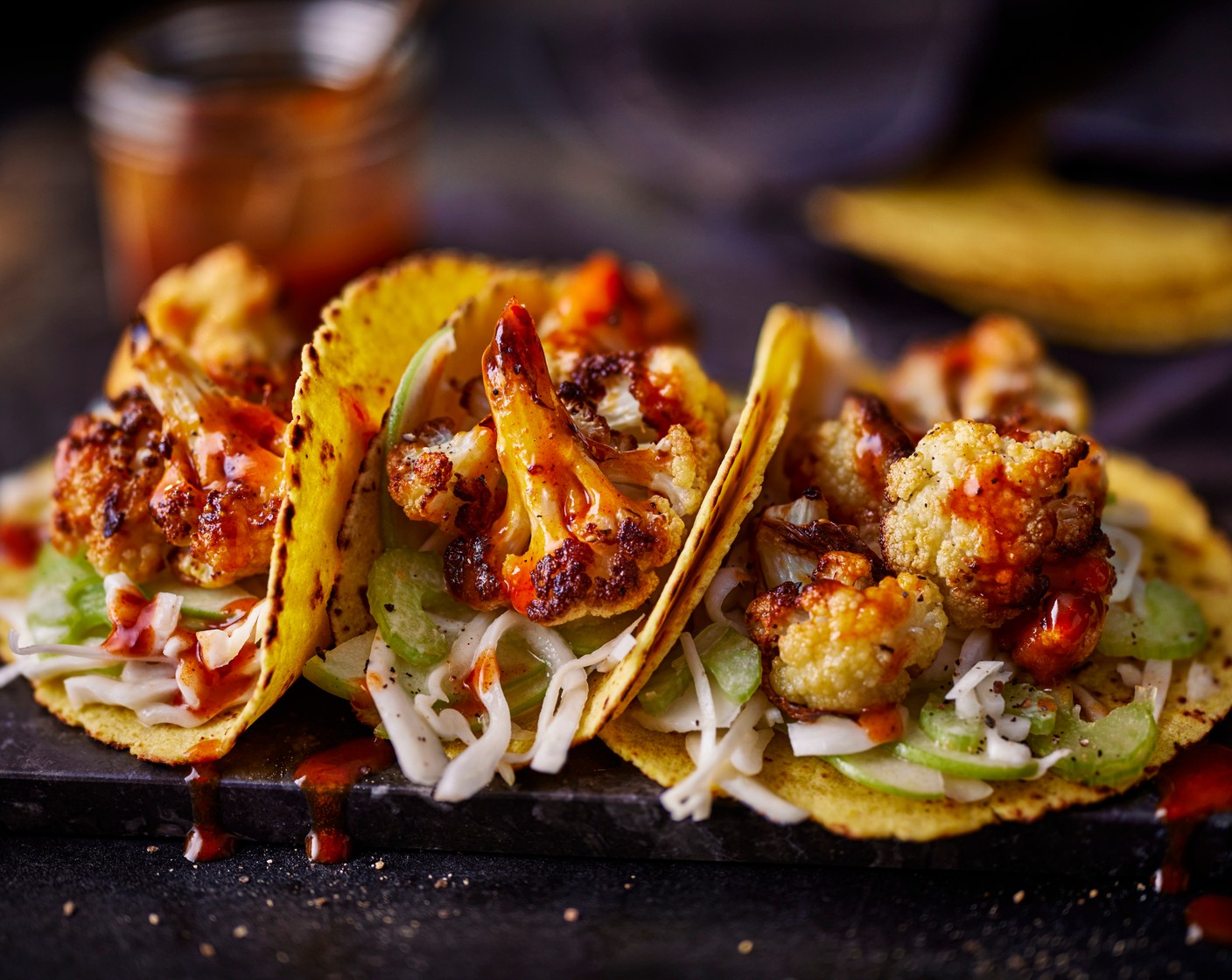 step 5 Serve the tacos with the slaw, sticky barbecue cauliflower and the buffalo sauce (to taste).