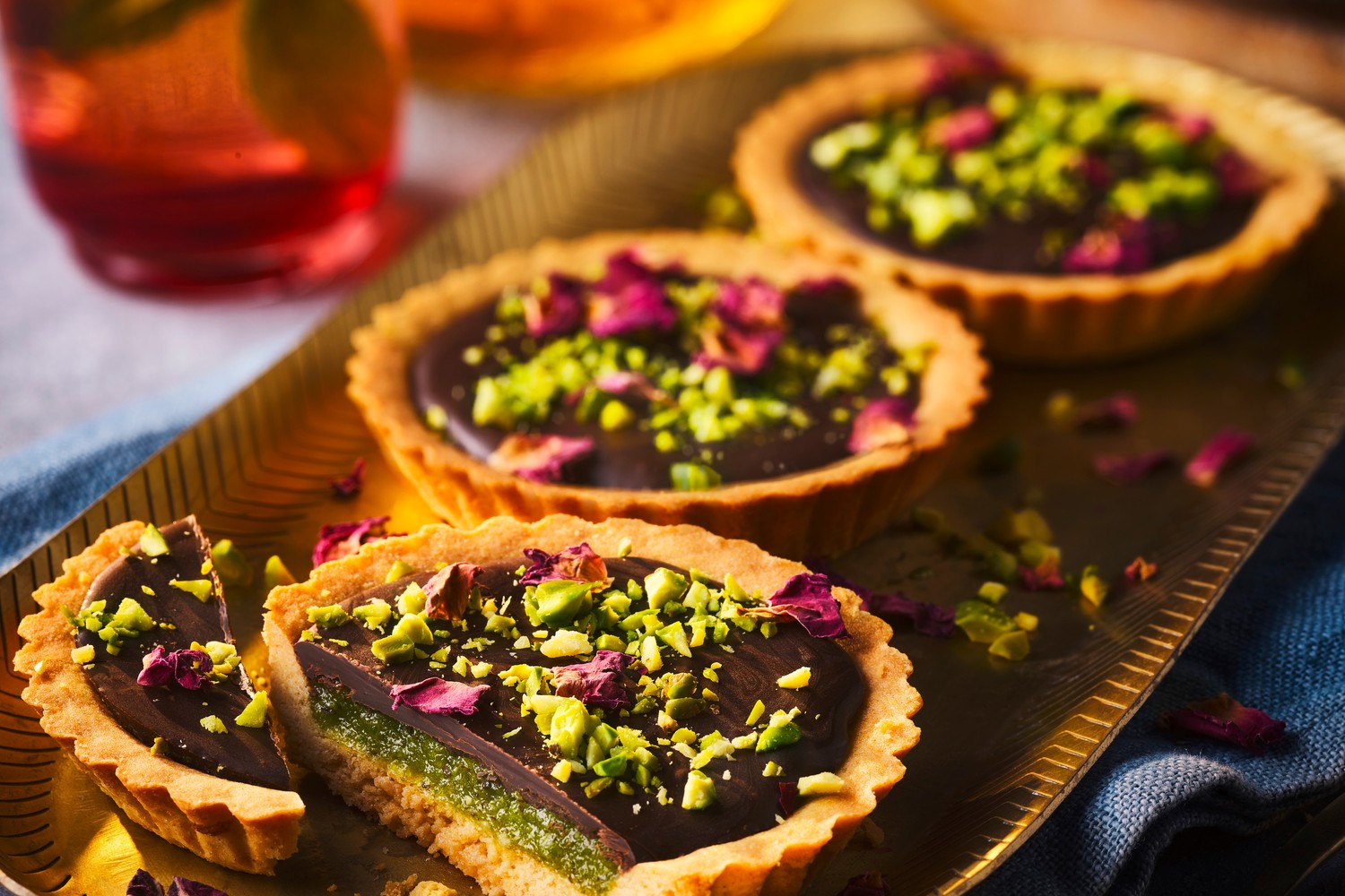 Pistachio and dark chocolate tarts