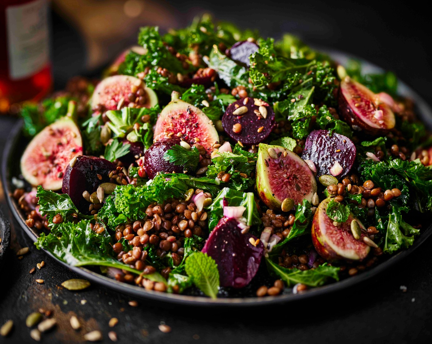 step 4 Top the lentil salad with the figs (4) and spoon over the remaining dressing, then scatter over the seeds. Finish with some extra fresh herbs.