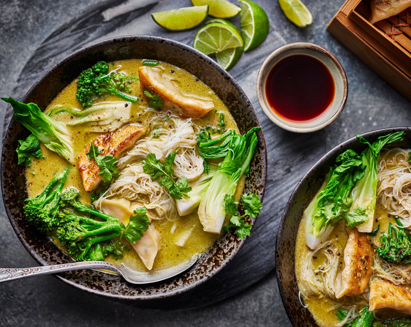 step 4 Spoon the cooked noodles into four bowls and ladle over the soup. Arrange the gyoza on top and serve with the lime wedges (1), coriander (1 handful) and ponzu dip that comes with the gyoza on the side.