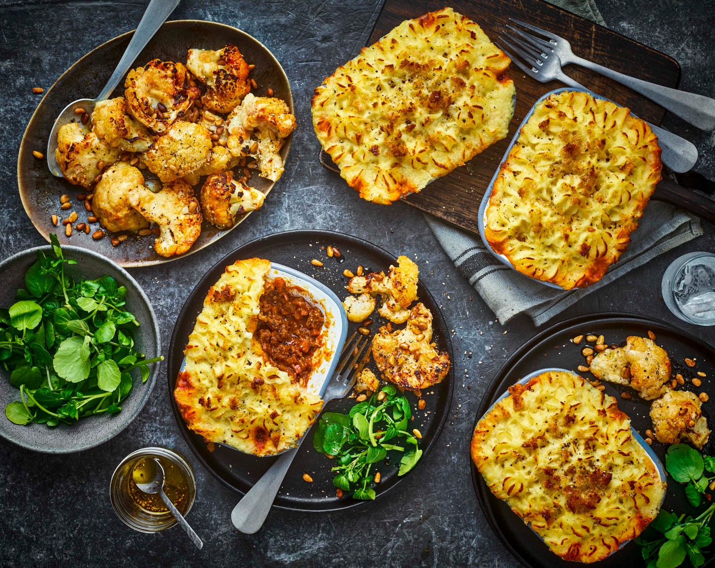 Cottage pie with roasted cheesy spiced cauliflower and watercress salad