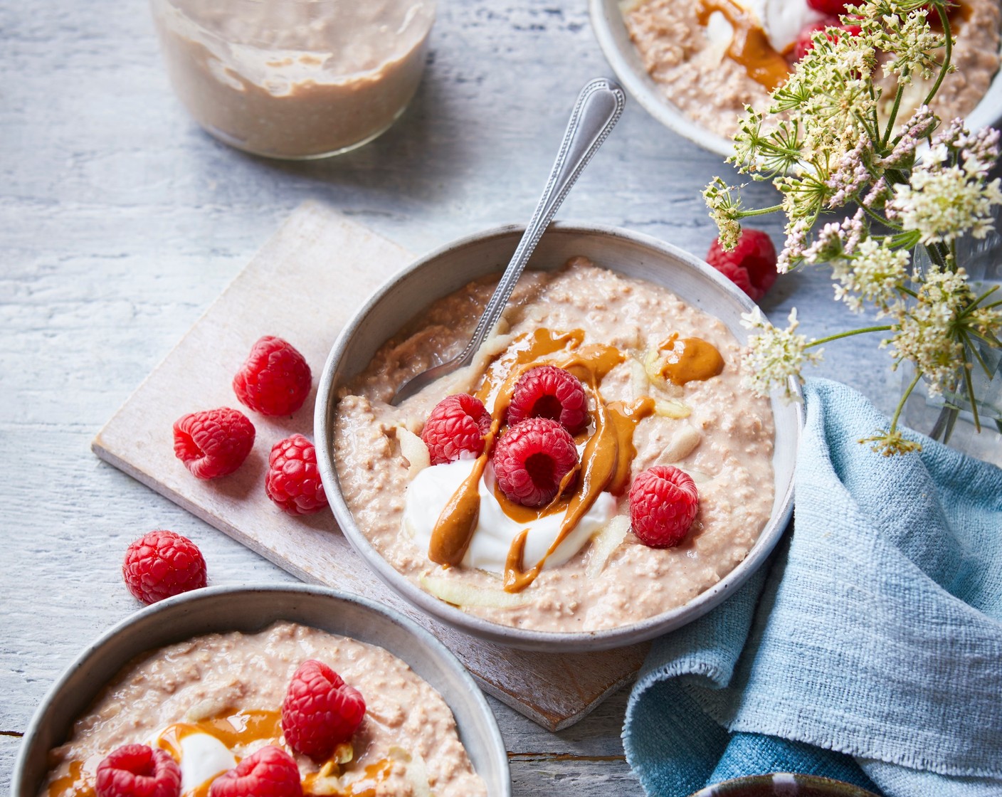 step 2 The next day, spoon the mix into 4 bowls and top each with a spoonful of peanut butter (4 tsp) and a scattering of fresh raspberries (200 g). Loosen with a splash of extra milk, if you like.