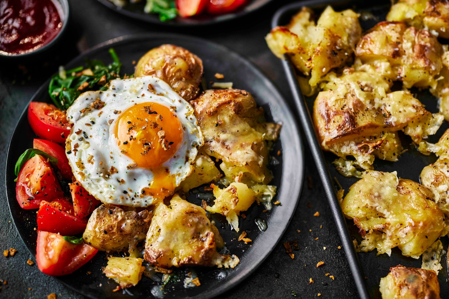 Smashed potato hash traybake recipe with fried eggs