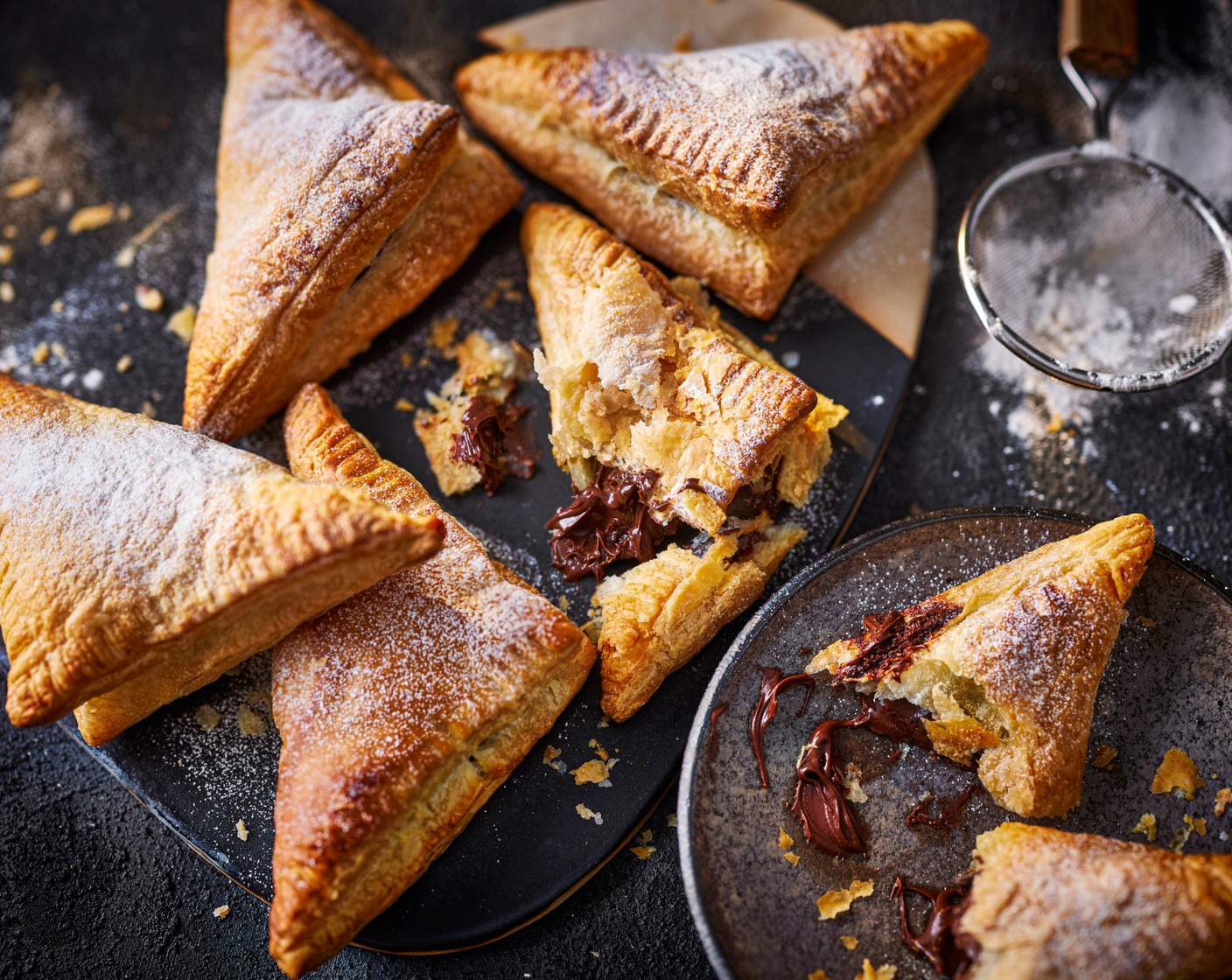 step 4 Dust the triangles with icing sugar (2 tbsp), then tuck in.