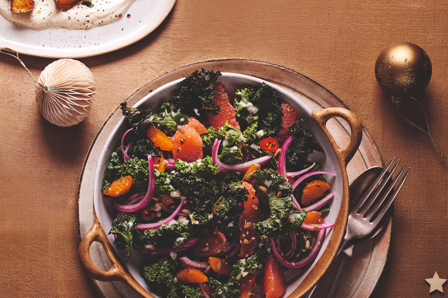 Crispy kale and citrus salad with coconut and ginger dressing