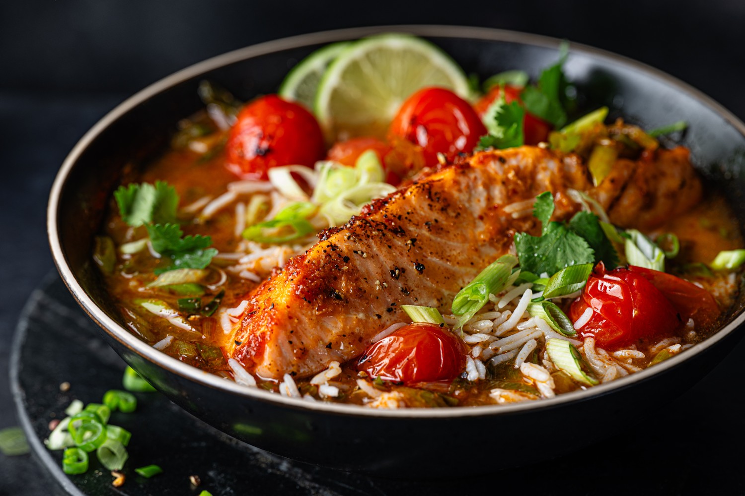 Thai red Salmon with blistered tomatoes and brothy rice