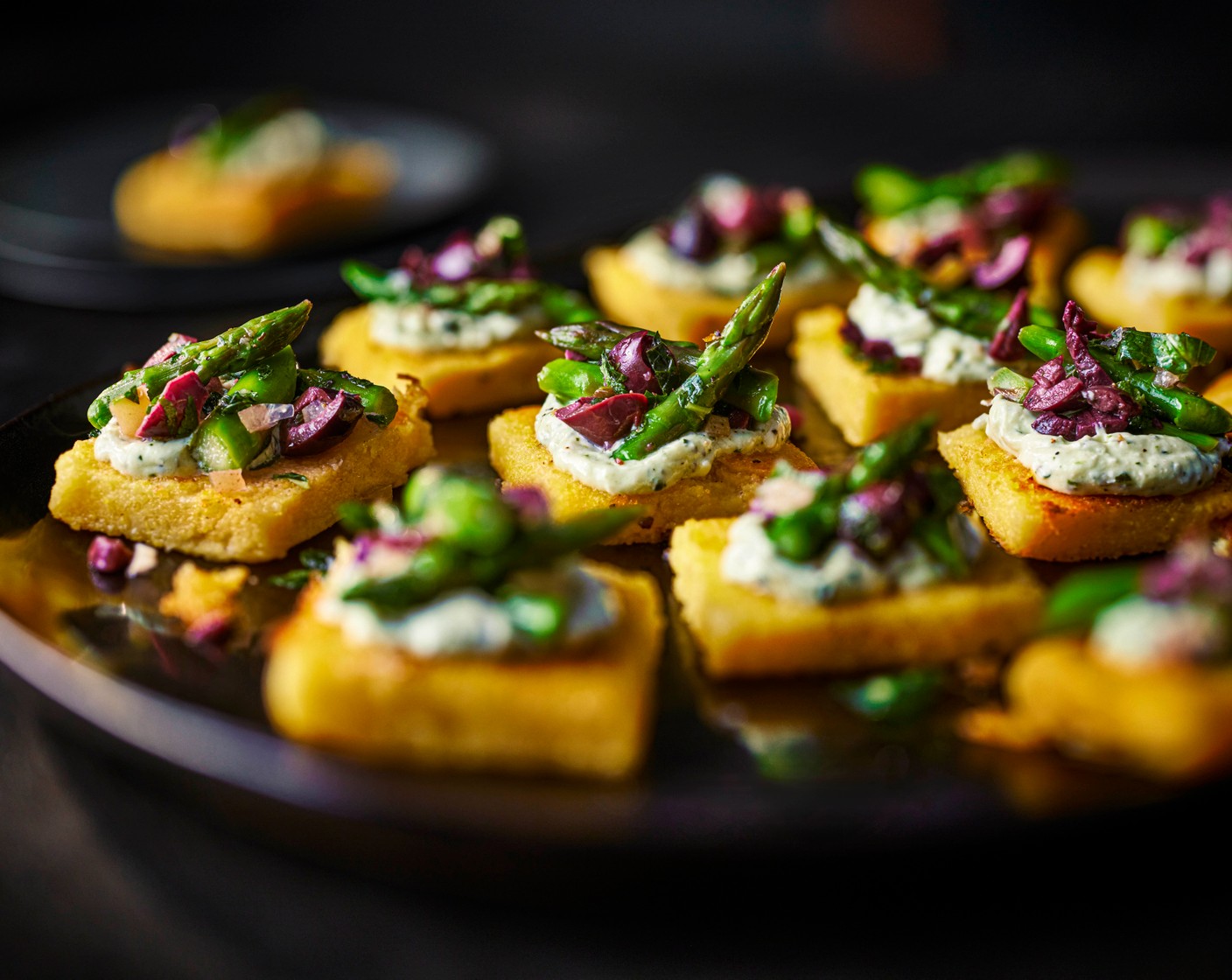 step 8 Leave to cool slightly, then top with the whipped feta dip (1 pack) and spoon over the asparagus salad.