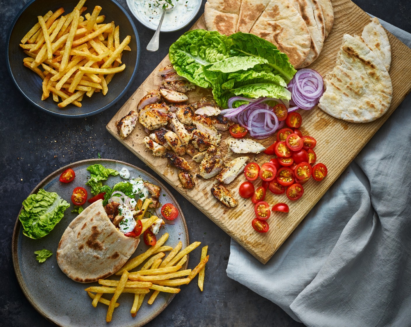 step 5 Put some chicken strips into each pitta along with a few French fries. Serve each pitta with a handful more French fries as a side.