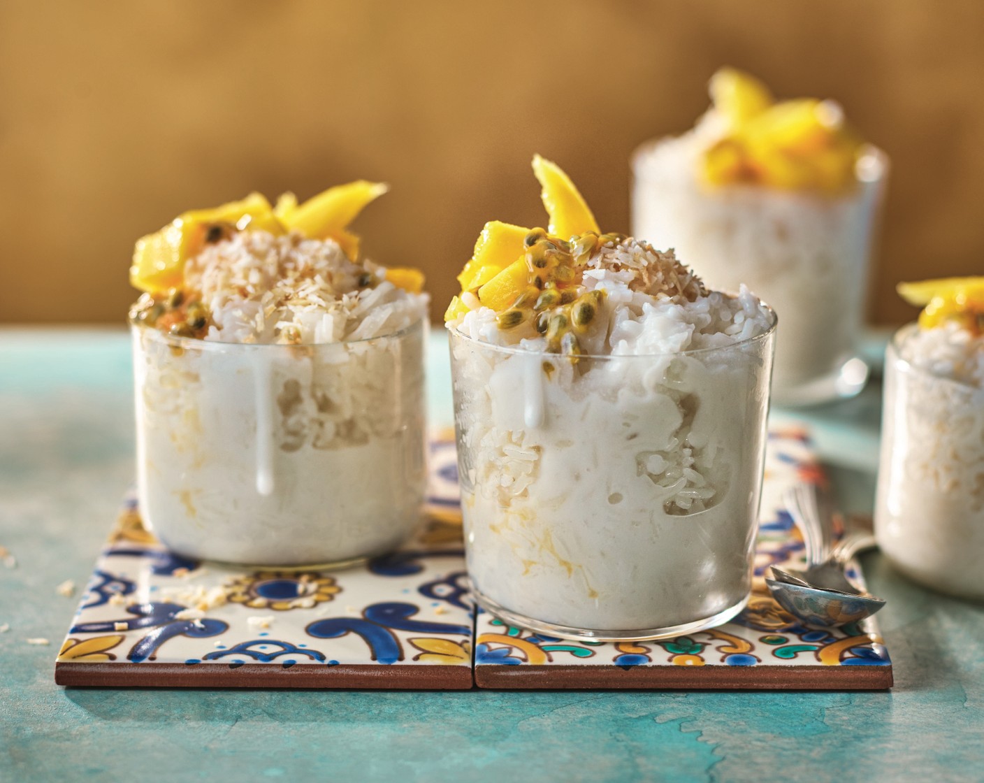 step 4 Divide the rice between serving bowls and serve topped with a little more of the sweetened coconut milk, the sliced mango (1/2), the passion fruit (1 pouch) and the toasted desiccated coconut (2 tbsp).