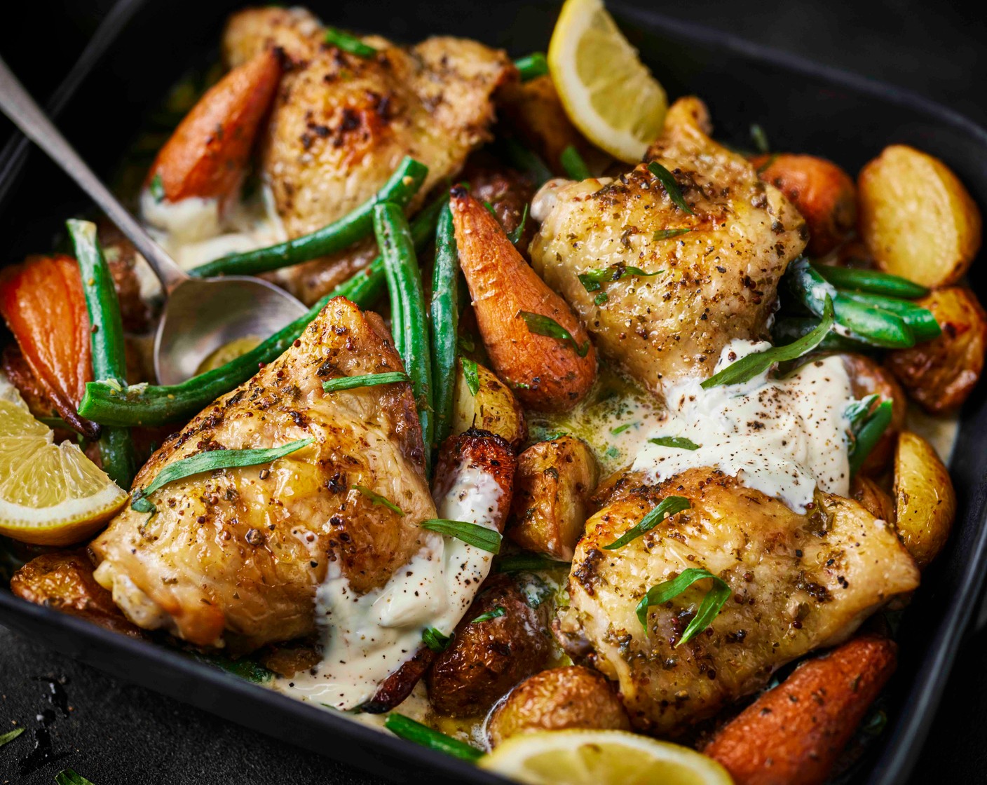 step 6 Once out of the oven, stir the crème fraîche (2 tbsp) and chopped tarragon (1 handful) through the vegetables and sauce. Finish with a squeeze of lemon juice (1/2), if you like, and season to taste.