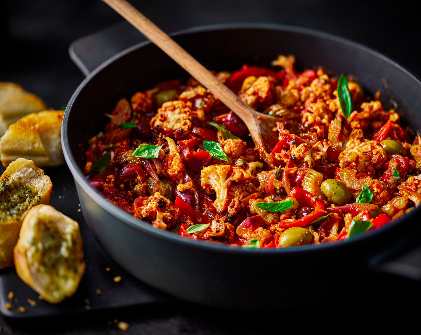 step 5 Serve the caponata with the garlic bread on the side, and a scattering of fresh basil (10 g).