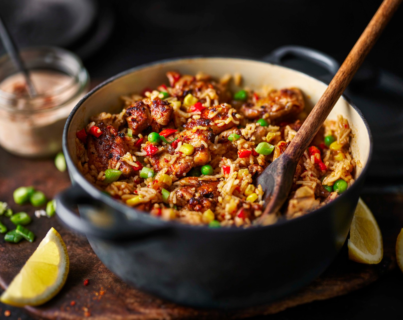 step 6 Top the chicken and rice with spring onions (2), a drizzle of piri piri yoghurt and the remaining lemon juice (1/2) squeezed on top.