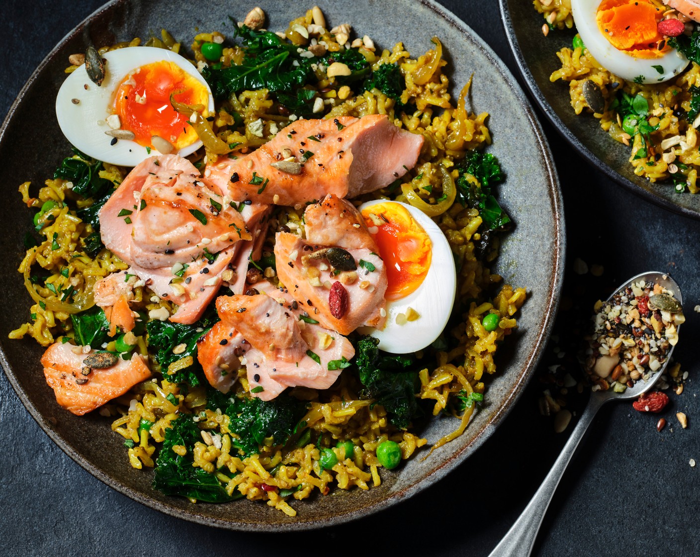 step 6 Fluff up the rice and stir through the parsley (2 tbsp). Flake the salmon on top and serve each topped with a halved egg, more fresh parsley, a lemon wedge (1) and a sprinkle of seeds (2 tbsp).