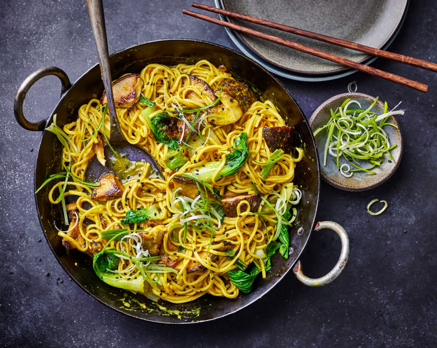 step 4 Use tongs to add the hot noodles and pak choi to the sauce, tossing until glossy. Spoon into bowls and serve with the sesame seeds (1 tsp) on top.