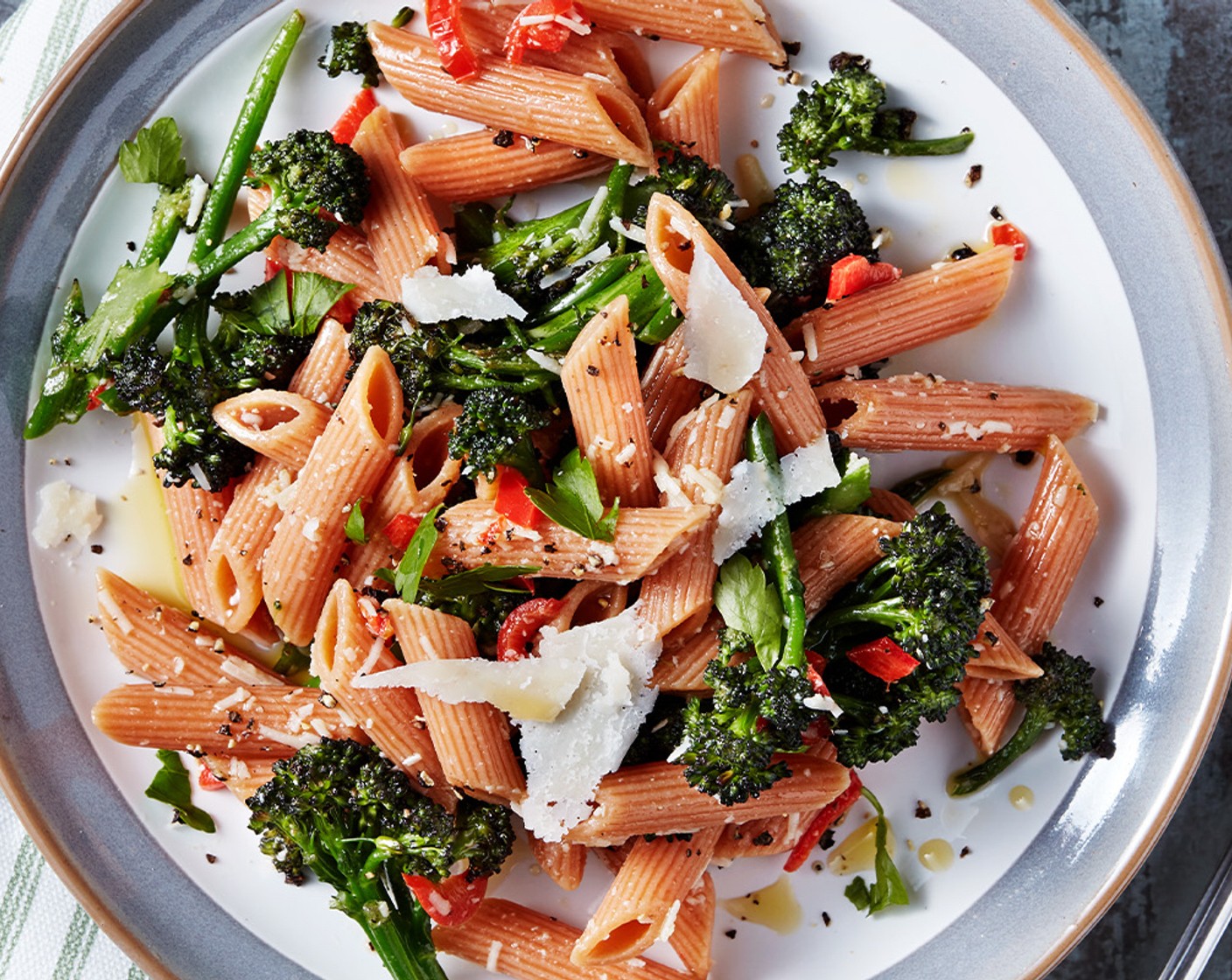 step 4 Toss the cooked pasta through the broccoli and serve with a generous amount of fresh parmesan shavings (50 g) and a handful of chopped fresh parsley (1 handful).