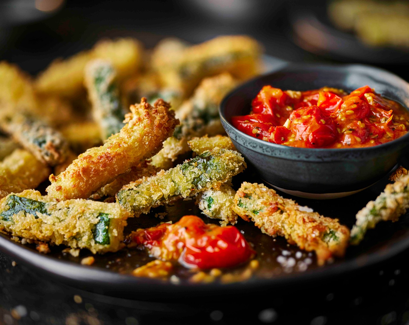 step 5 Serve the courgette fritti with the cherry tomato marinara and finish with a pinch of flaky salt.