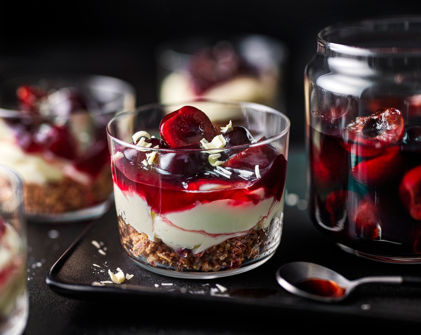 step 8 To serve, garnish with the soaked king cherries and finish with white chocolate shavings (50 g).