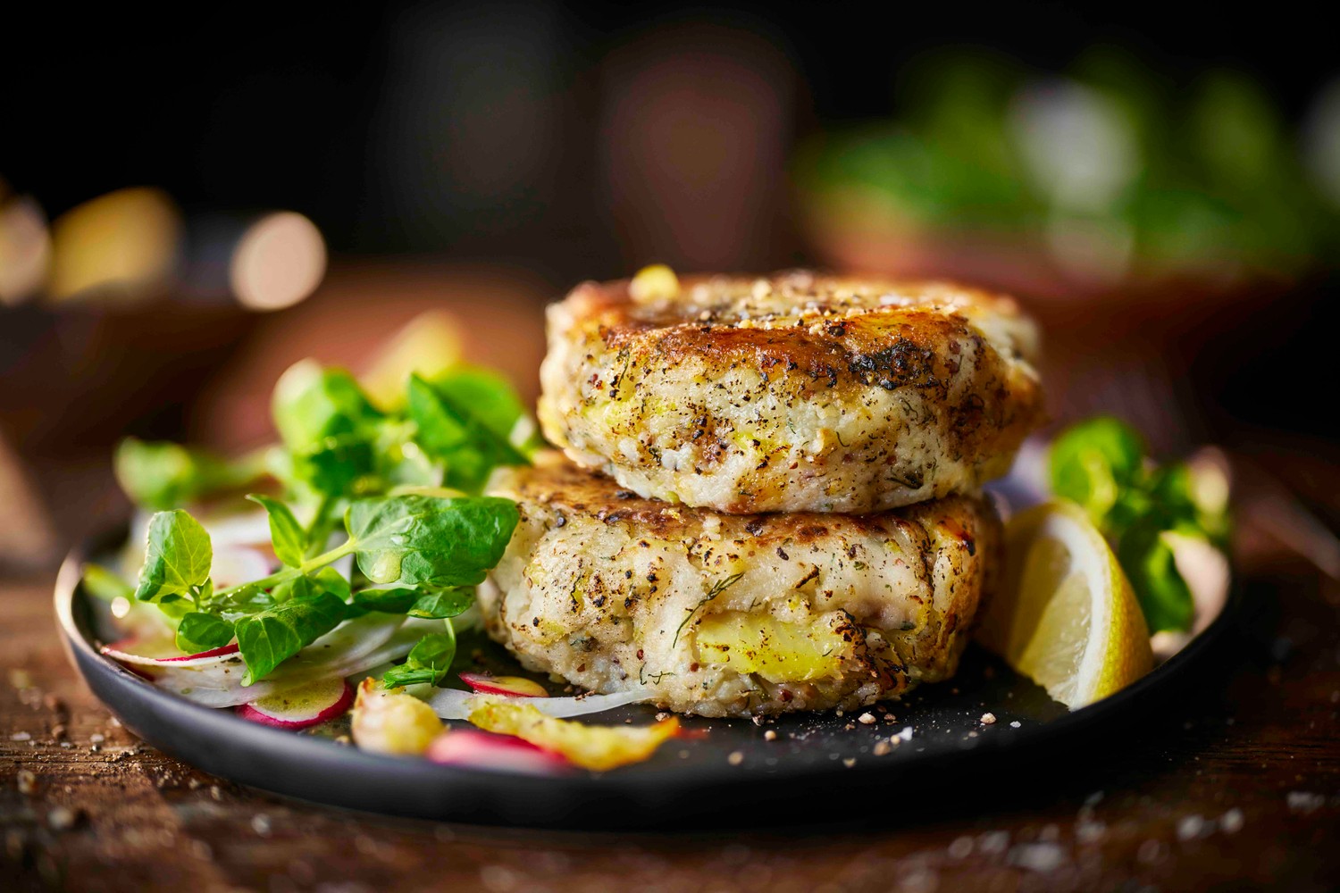 Warm haddock fish cakes with watercress and radish salad