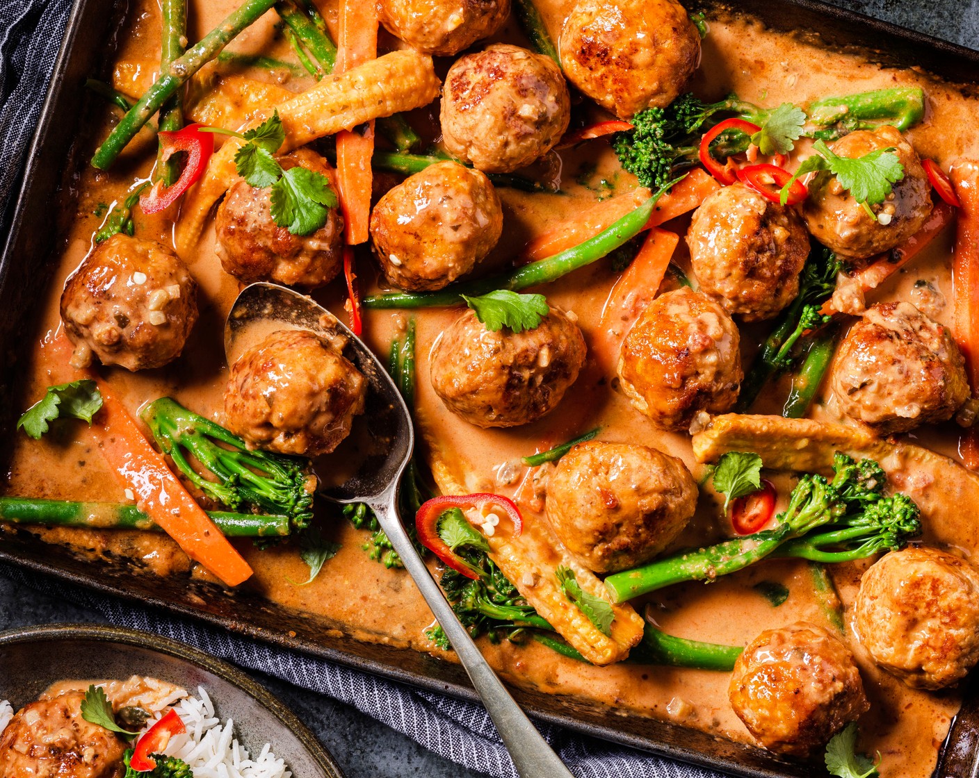 step 6 Serve the rice in bowls, topped with the satay meatballs, and a scattering of fresh coriander (1 handful) and chilli (1), to taste.