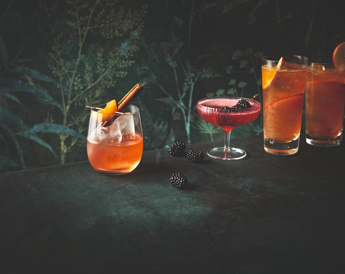 step 2 Once cooled, strain to remove the apples and vanilla. Fill two tall glasses with ice, then pour over the tea. Top up with the brandy (90 ml) and soda water (500 ml), then garnish with the reserved apple.