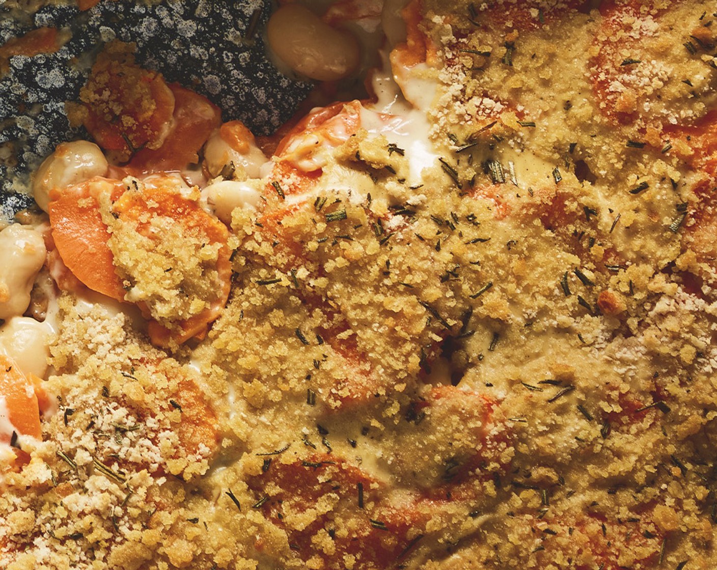 step 3 Cover with the remaining béchamel, then scatter over the breadcrumbs (75 g) and the reserved chopped rosemary. Bake in the oven for 1 hour or so, until the breadcrumbs are golden and the sweet potato is tender when a knife is stuck in. Leave to cool for a few minutes, then serve with steamed green vegetables, if you like.