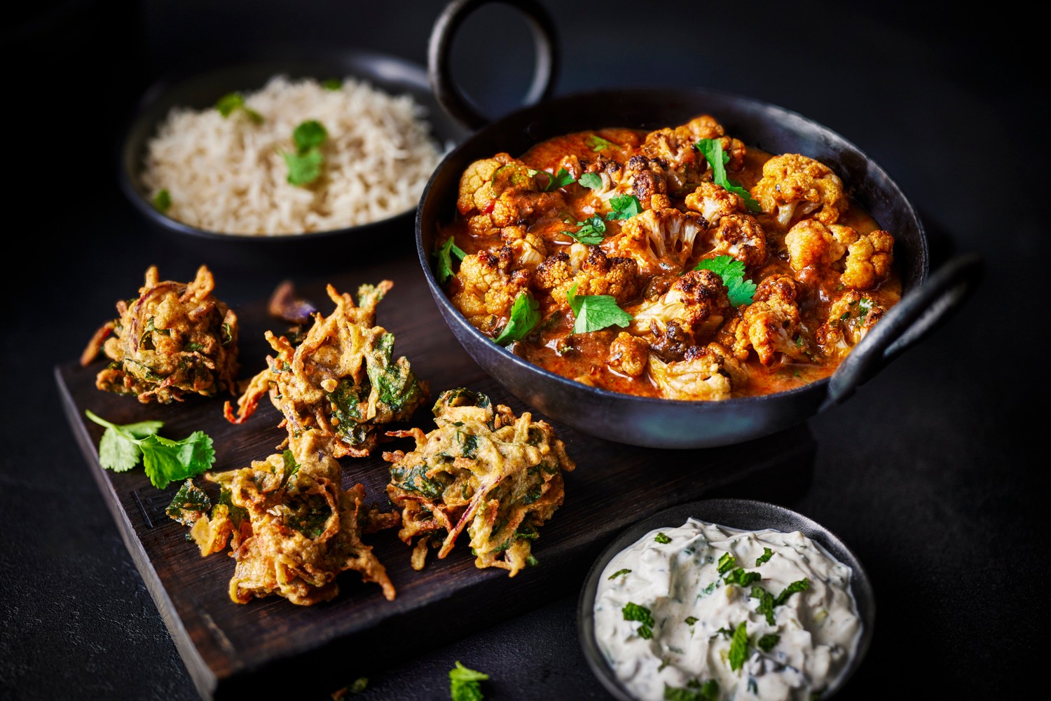 Cauliflower tikka masala and veggie pakoras