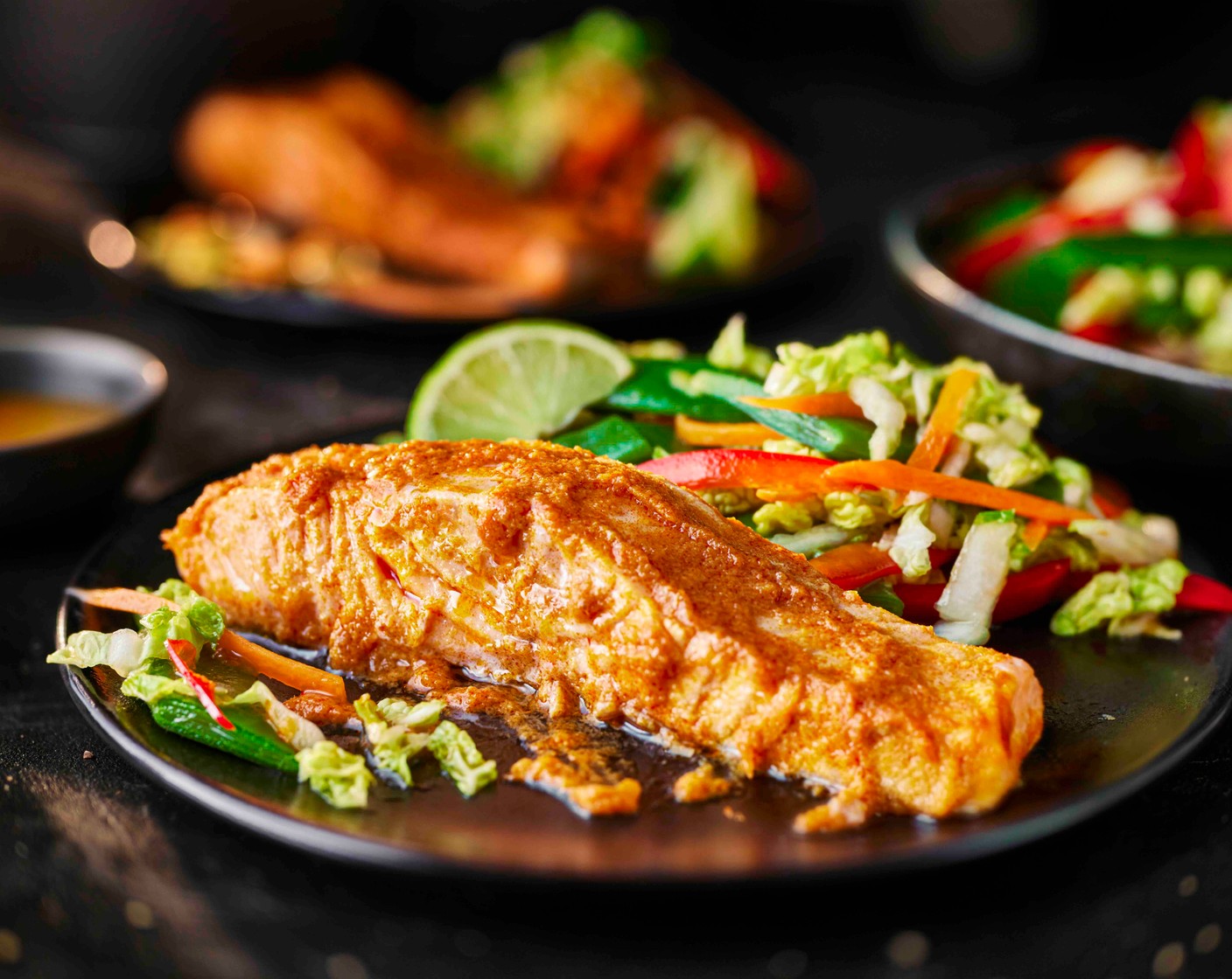 step 6 Serve the Thai red salmon alongside the slaw, with the remaining lime (1), cut into wedges.