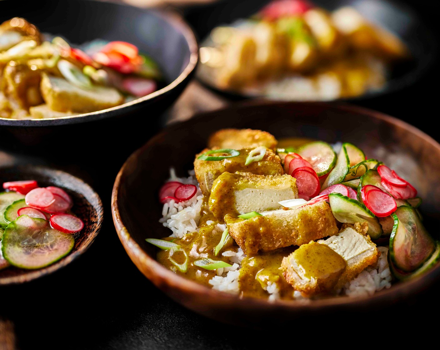 step 6 Cook the sticky rice (2 packs) on full power in the microwave for 2 minutes. Serve the rice topped with the crispy tofu, pickles, curry sauce and spring onions (2).