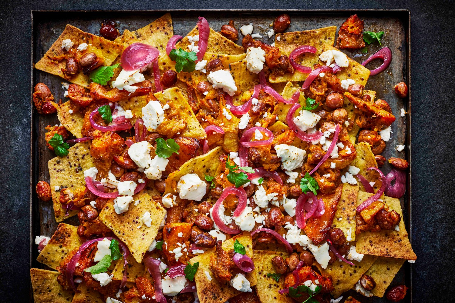 Feta and pink peppercorn nachos