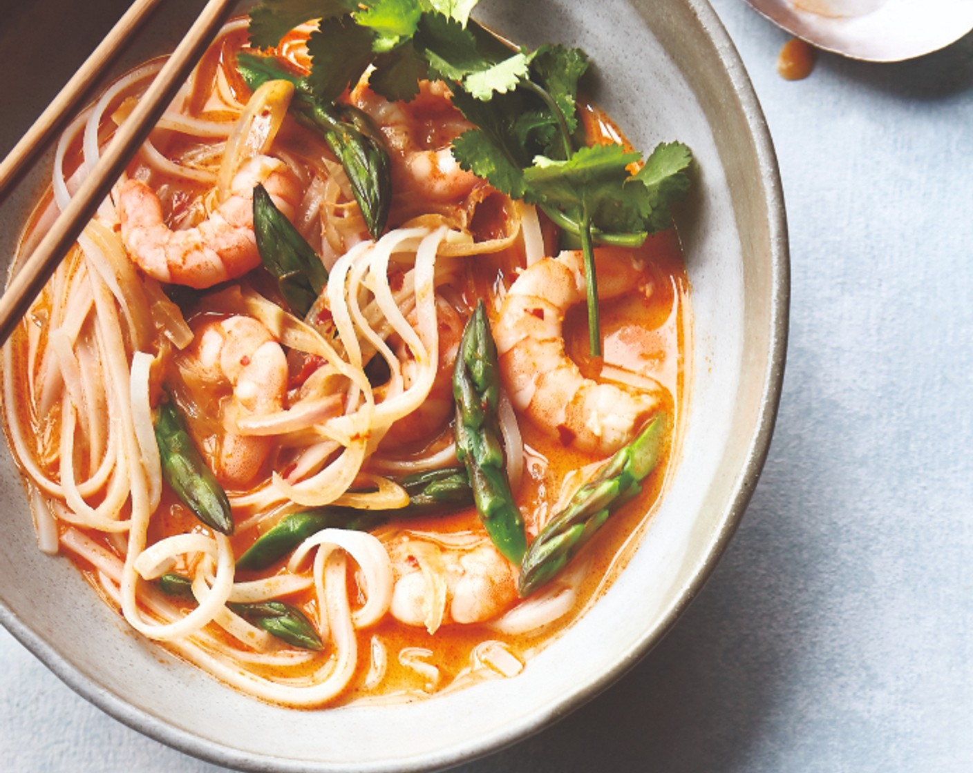 step 4 Stir in the coriander (25 g), fish sauce (1 tsp) and lime juice (1). Drain the noodles and stir into the soup. Ladle into bowls and serve straight away.